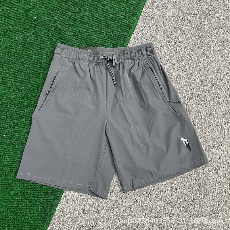 Fabricantes al por mayor de pantalones cortos deportivos para hombres de velocidad de hielo seco maratón de verano delgado entrenamiento de acondicionamiento físico pantalones de moda