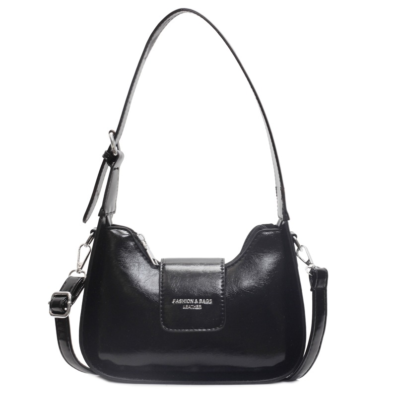 Nicho Zhong simple y versátil bolso de brazo para mujeres 2025, nuevo estilo de moda casual bolso de hombro de alta sensación bolso de media luna de mano