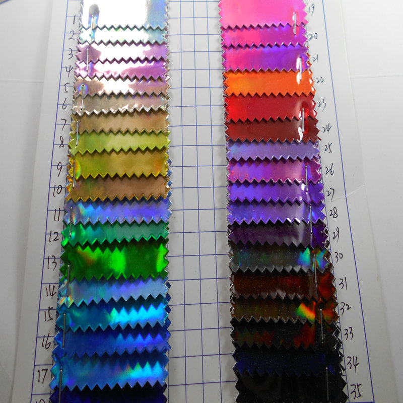 tpu镜面镭射幻彩七彩漆皮人造革反光炫彩高光合成革箱包手袋面料