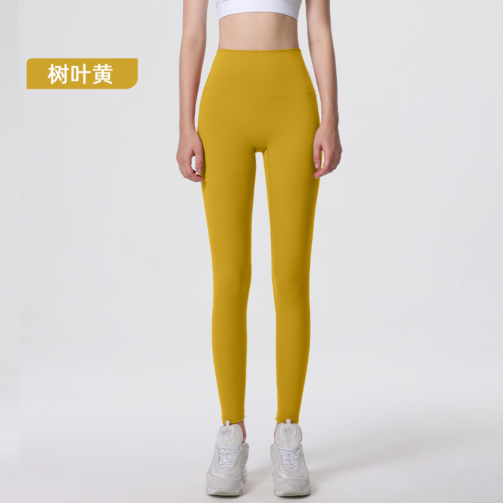 Nuevos deportes de yoga cintura alta desnuda sensación de no vergüenza línea piel-friendly levantamiento de la cadera del vientre que no se contrae la caída de la aptitud de las mujeres pantalones recortados