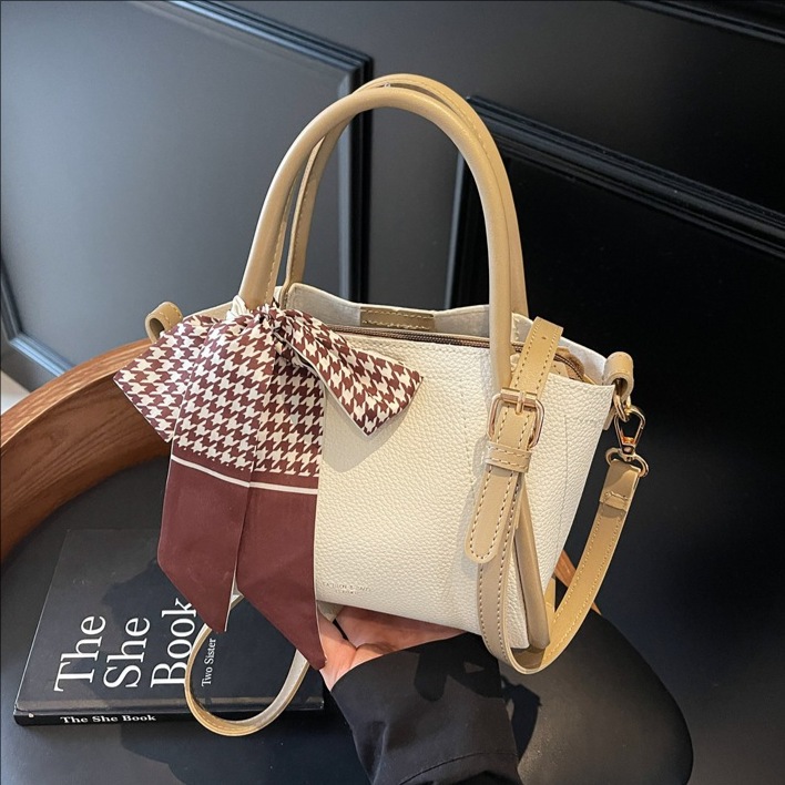 Bolso de cubo con patrón de lichi de alta gama para mujer 2025 nueva tendencia bolso de mensajero de todo fósforo casual bolso de cubo hembra portátil