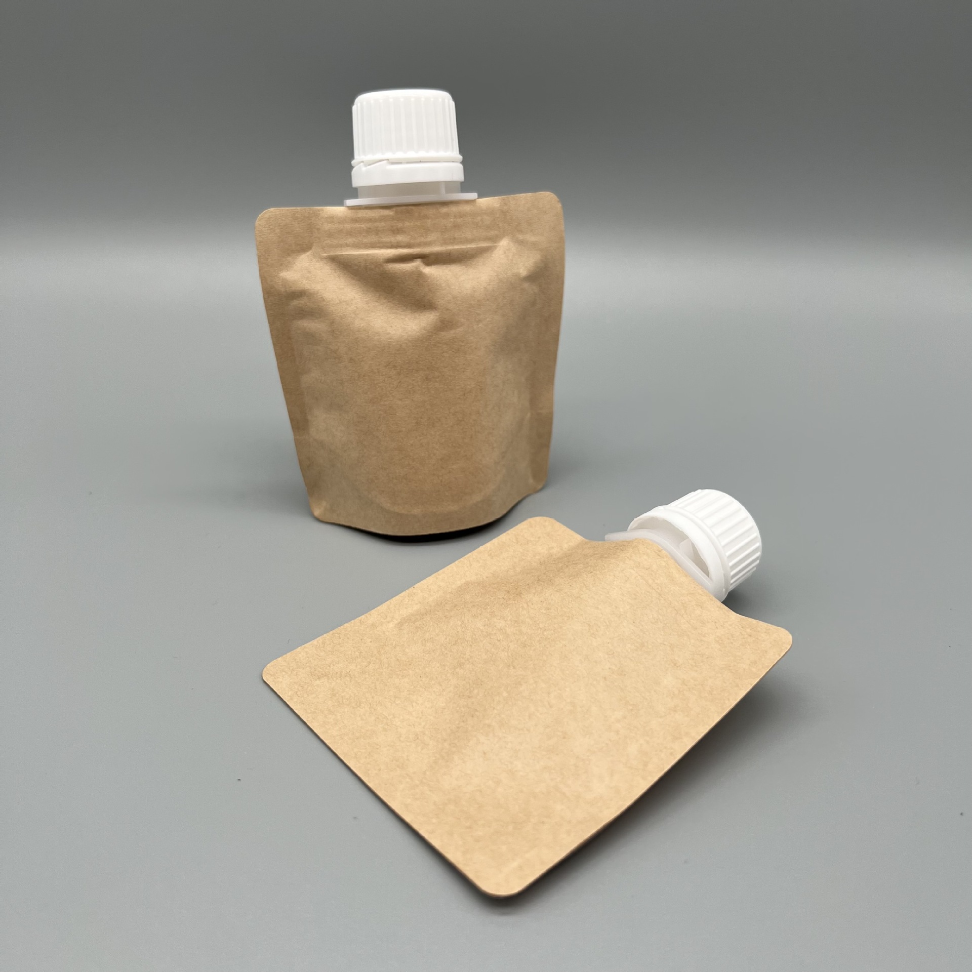 牛皮纸面膜铝箔袋 化妆品乳液包装袋 个性异形自立吸嘴袋面膜袋