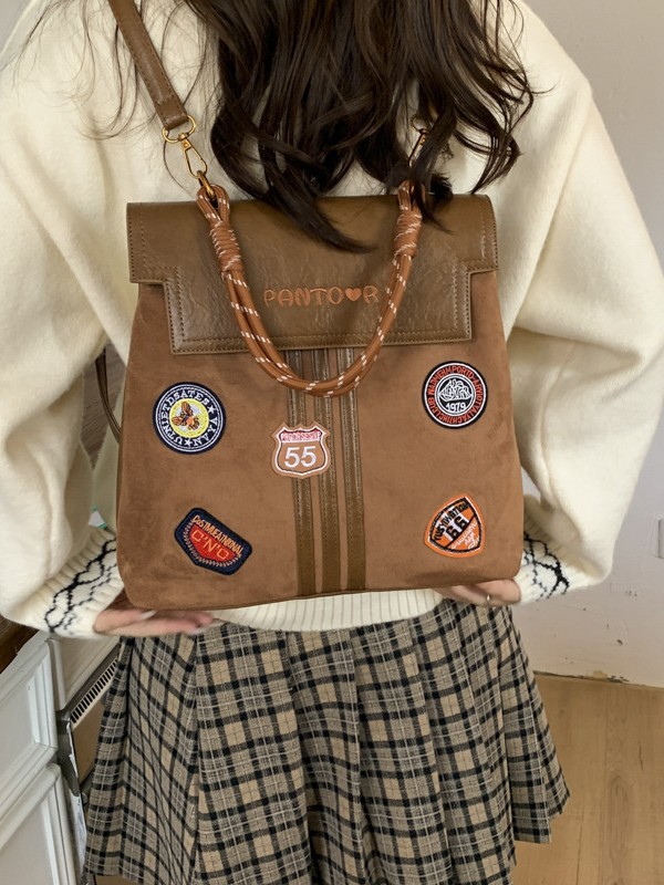 Comercio exterior insignia transfronteriza clase universidad mochila de viaje de la escuela de moda mejora la sensación de calidad retro mochila de gran capacidad