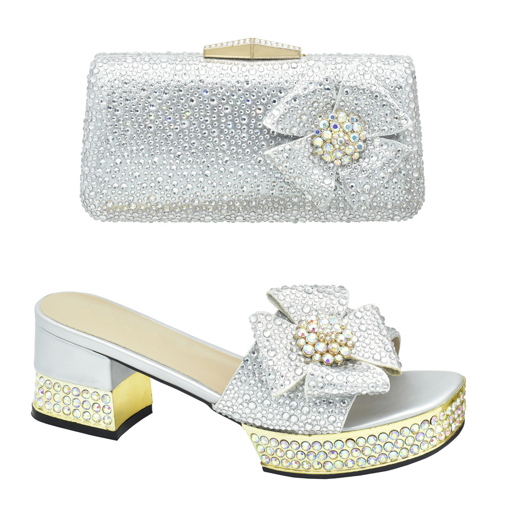 Accessorize the evening with applique studded high-heeled sandals and a full cloth small flash diamond dinner bag set with sandals_voghion.com
