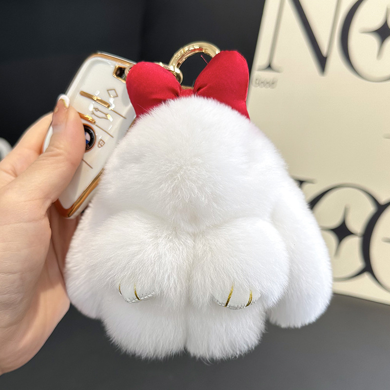 卸売りのかわいいウサギの毛の蝶結びの小さいウサギの自動車のキーホルダーはぬいぐるみのかばんを掛けて飾ります。