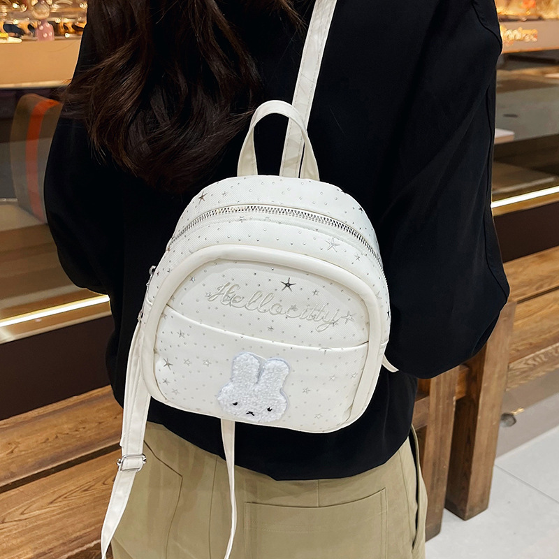 Mochila de viento encantadora de dibujos animados para mujeres 2026 nueva moda, mochila de estudiantes portátil, mini mochila de viaje ligera