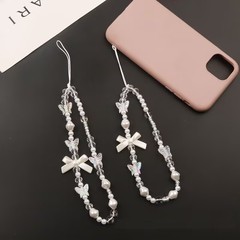 Ins風携帯電話のストラップの短いデザインの創意的な蝶結びの白い模造真珠のストラップの部品のバッグの装飾ccdのストラップ