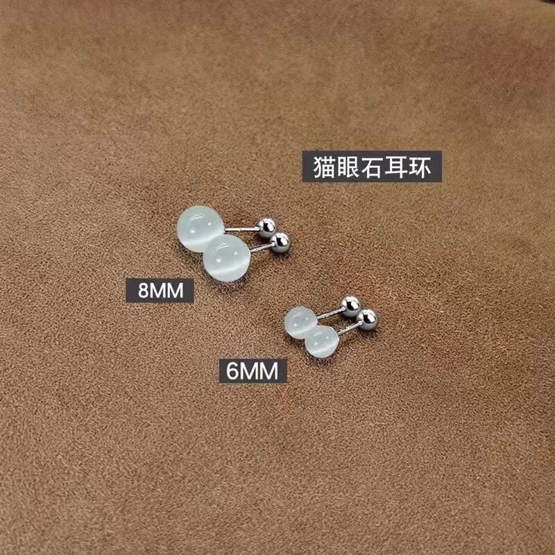 女性用キャッツアイストーンイヤリング、ニッチデザイン、スレッドツイストバックル、就寝時に外す必要なし、高級耳ピアス、スパイラルイヤリング|undefined