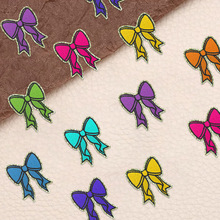 东莞电脑绣花厂跨境热卖蝴蝶结布贴可定制魔术贴毛巾绣格力特布贴