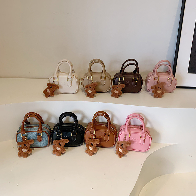Bolsa de hombro coreana para niños y niñas, estilo extranjero, mini lindos colgantes de oso, bolsas de mano, bolsas de bolos para niños.
