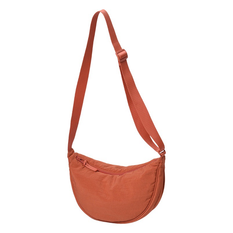 Fábrica UJIA mismo estilo dumpling bolsa hembra INS axila bolsa de nylon simple bolso de hombro nicho diseño bolsa de mensajero al por mayor