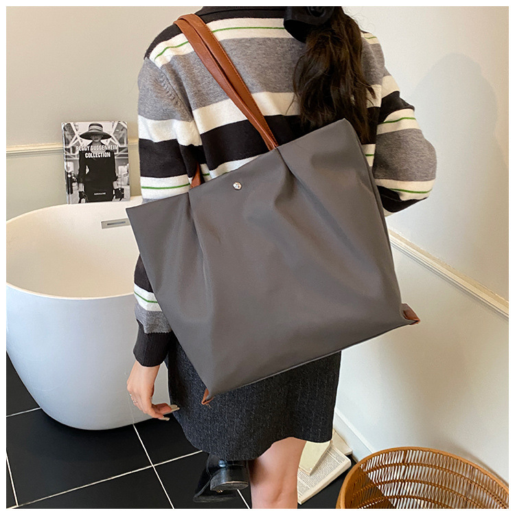 Borsa a tracolla casual da donna in tessuto Oxford, capiente, elegante e versatile, ideale per gli spostamenti quotidiani._voghion.com