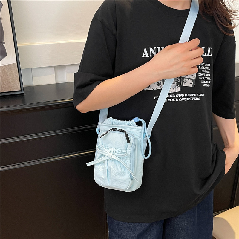 Bolso de teléfono móvil de moda coreana 2025 verano nuevo bolso femenino lindo lazo bolso de hombro bolso de mensajero de lona casual