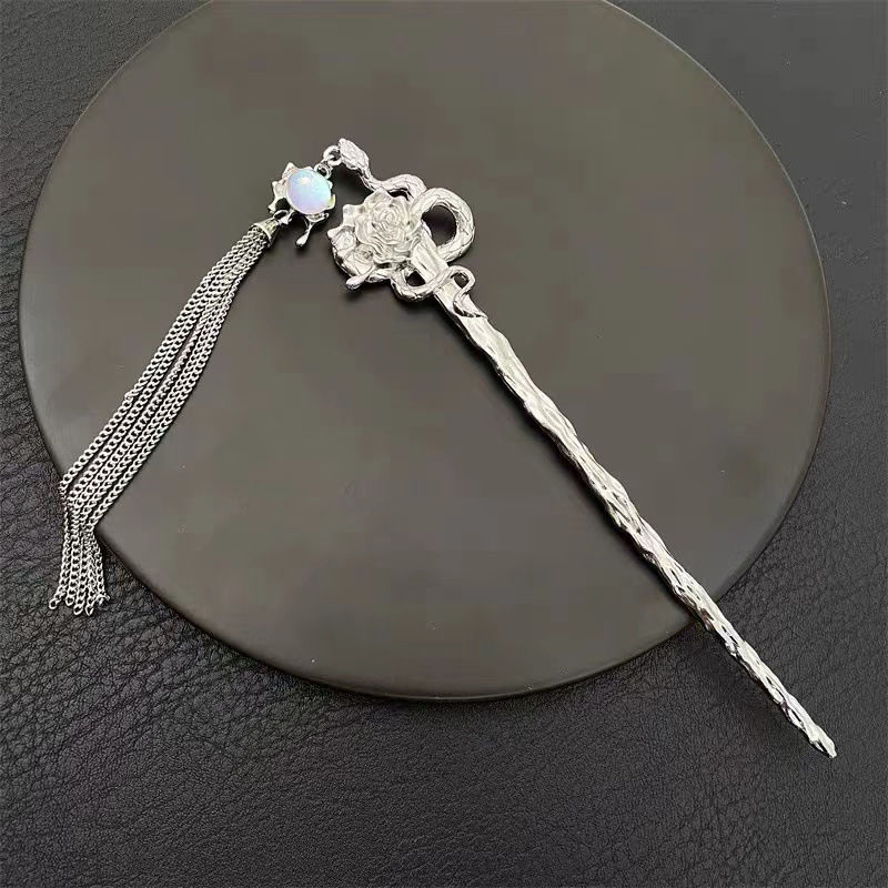 Horquilla con borlas de serpiente espiritual