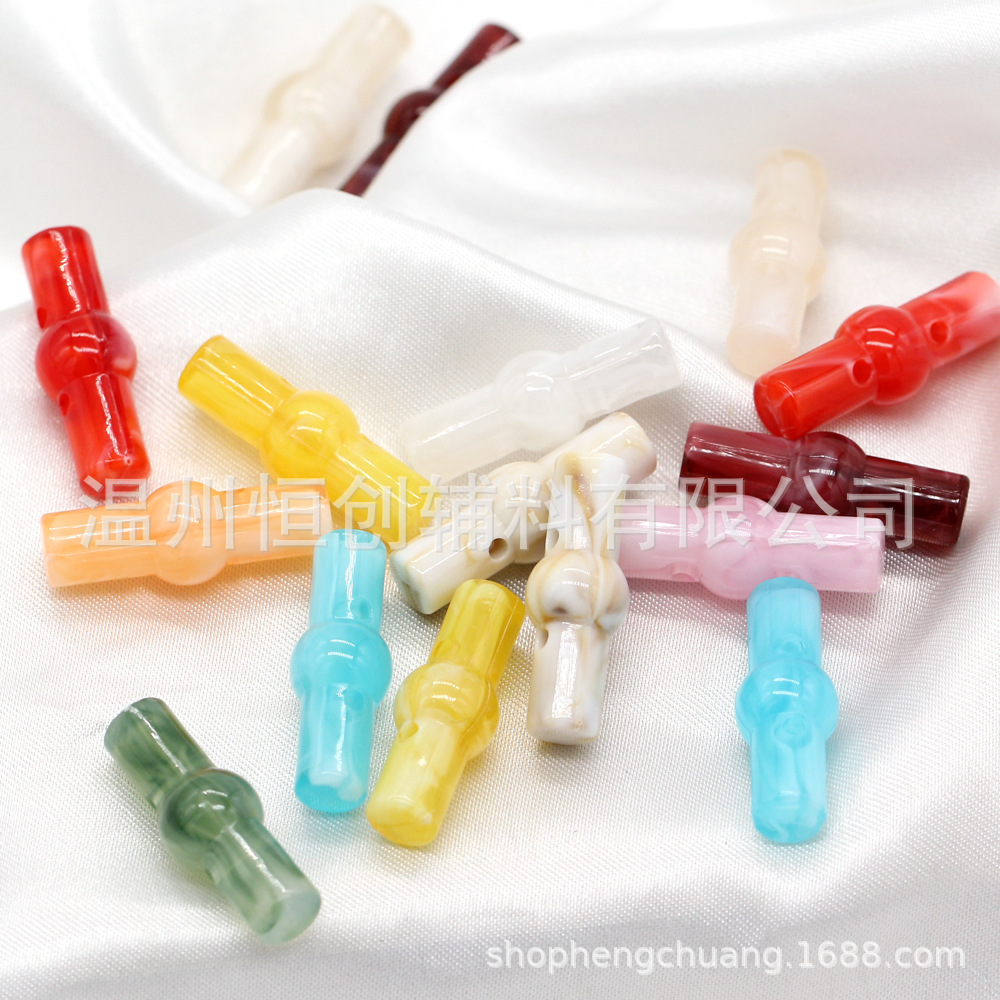 25x9mm brillante Hengchuang botón de resina cilíndrica de dos agujeros botón de estilo nacional suéter de punto botón de color de bricolaje al por mayor