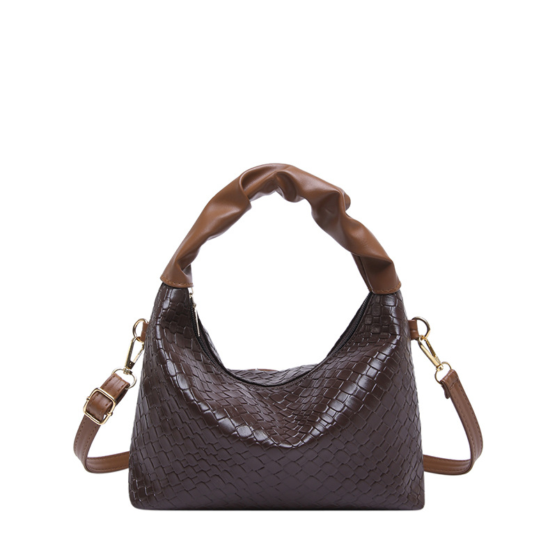 Este año bolsos populares de mujer diseño de tejido bolsos de mochila coreanos bolsos de transporte de aire extranjero 2024 nueva moda bolsos de hombro