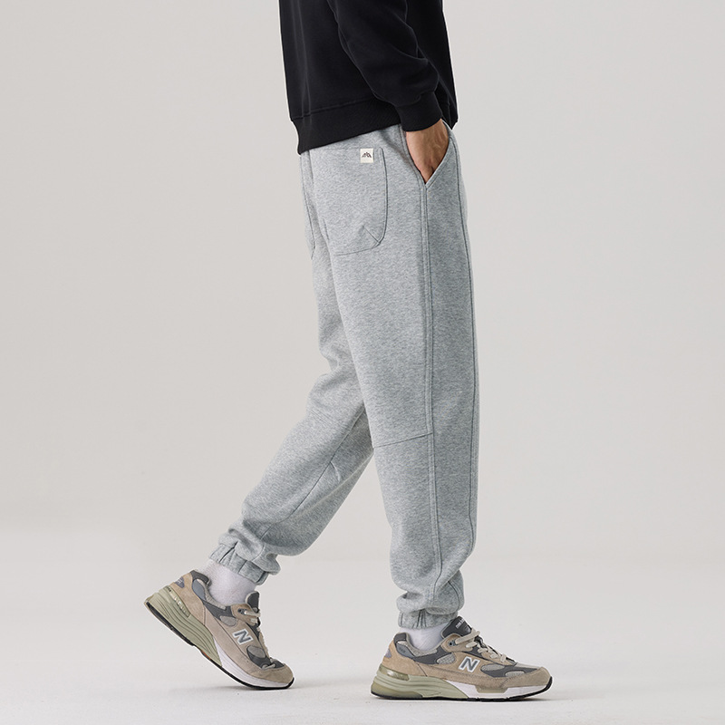 Mick Jones2025 caño hombre pantalones casuales sueltos versátiles estilo coreano de moda pantalones deportivos gris regular
