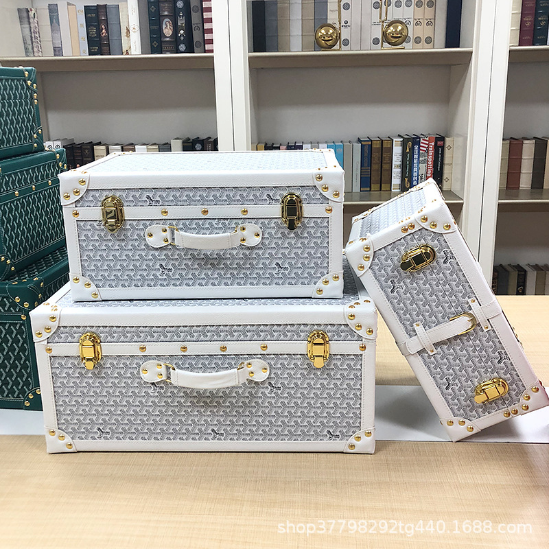 Gray and white suitcase