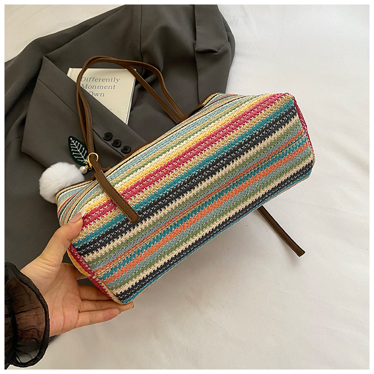 This is a new 2025 summer beach-style women's bag with a simple and versatile hand-held design. It's a single-shoulder vacation woven bag undefined