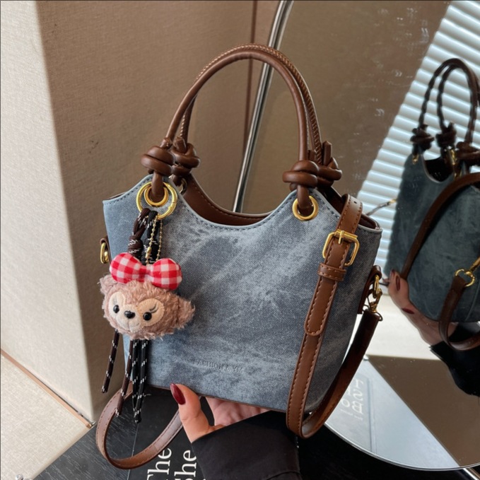 Bolsa de mano de alto nivel, bolso de cubo de moda, mujer, otoño y invierno, 2025, nuevo tipo de bolso de hombro casual, bolso de mochila universal.