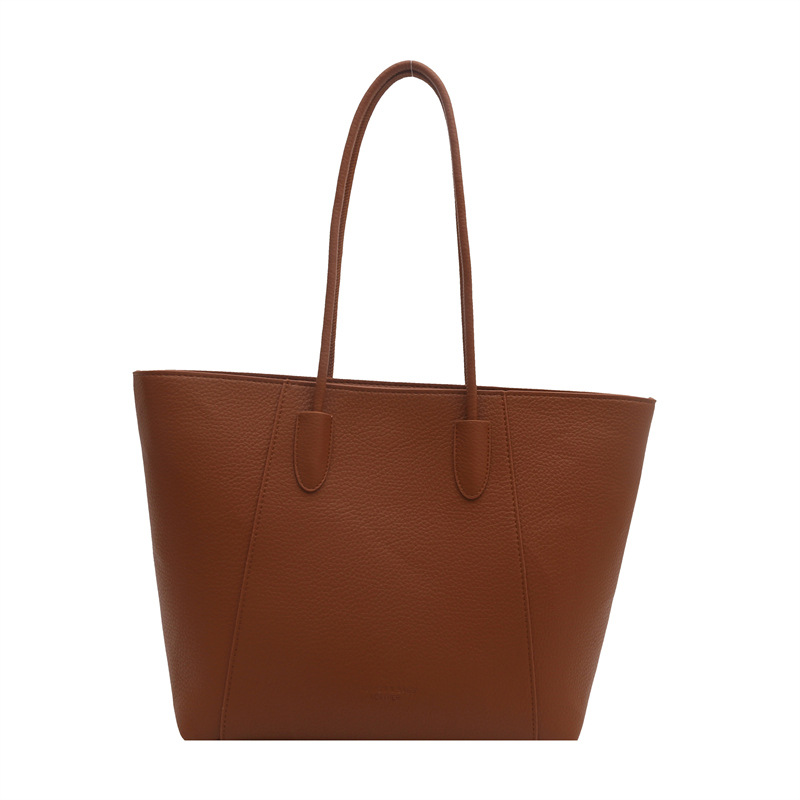 Bolsa de cubo retro de gran capacidad de superficie suave 2024 nueva moda de color sólido de viento relajado de viaje simple de hombro bolsa