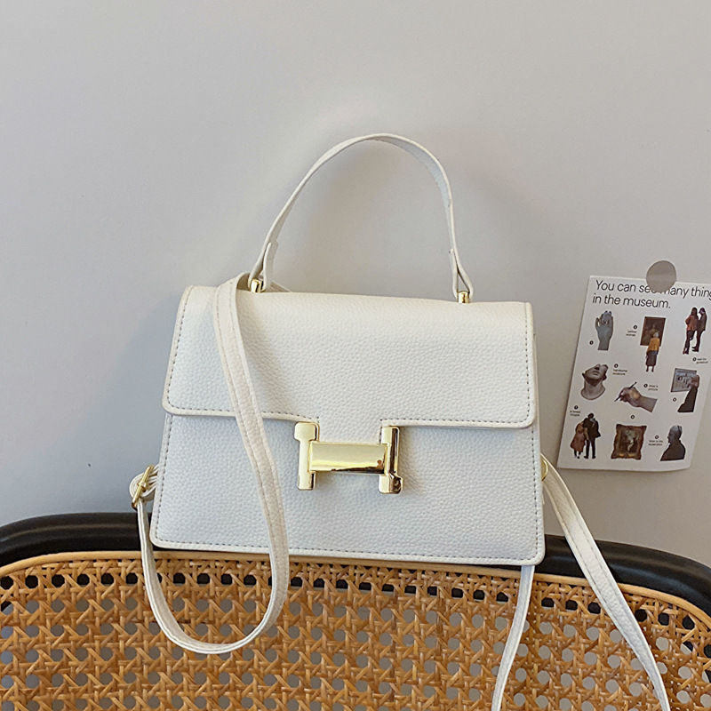 Bolso popular este año 2024 nueva textura bolso de mano cuadrado lichi patrón bolso de viaje de mujer mochila de hombro casual