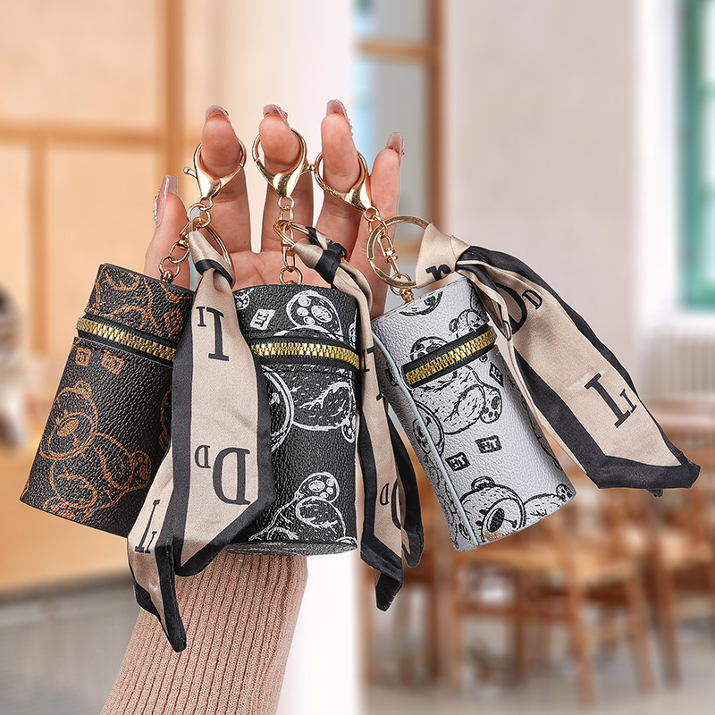 European and American presbyter coin purse 2025 new bear bag pendant earphone bag mouth red envelope mini key chain bag