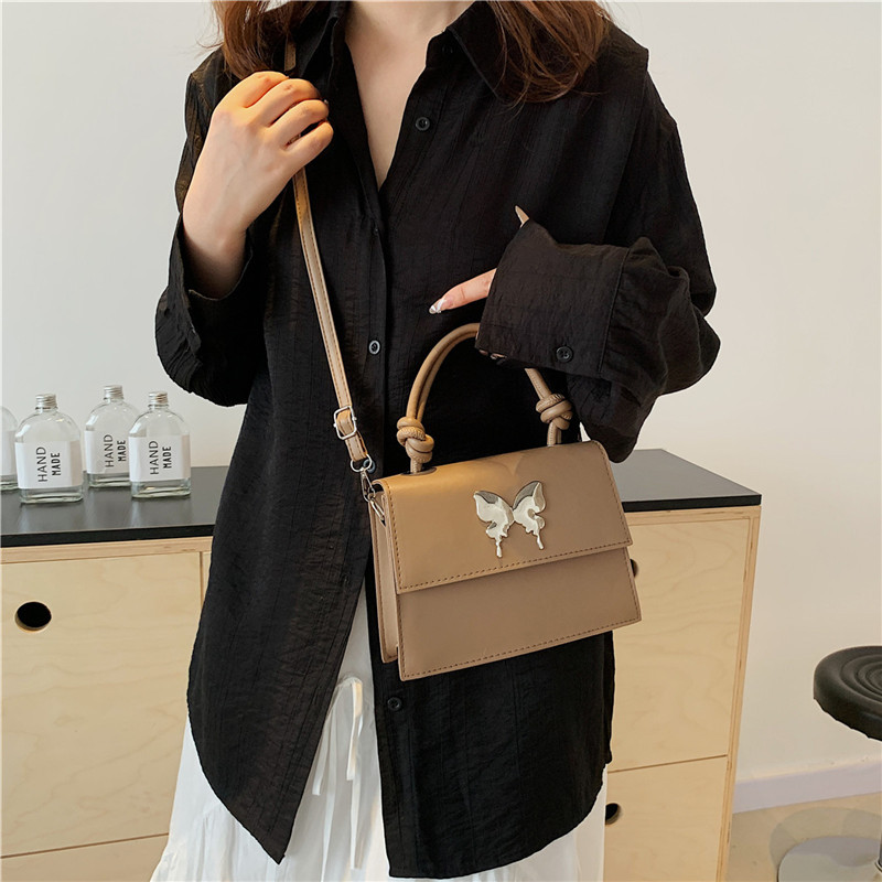 Diseño de nicho de lujo ligero bolso de mano de este año popular arco decoración de viaje diario mochila de hombro para mujeres