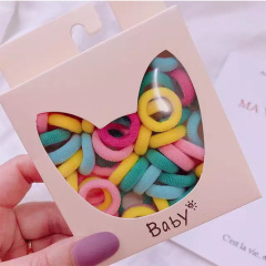 50本のキャンディー色のタオルリングの子供の髪輪の女の子は髪の小さいサイズの親指輪を刺して、高弾性の髪ひもを傷つけません。