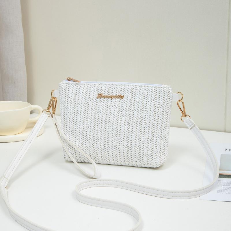 Bolso de verano para mujeres 2025, nuevo estilo de tela tejida bolso de paja de moda bolso de hombro con cámara bolso de mochila un cabello