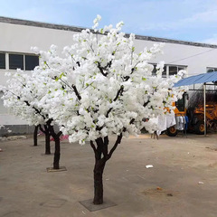 白い桜の木の偽の木のネットの赤い背景の木の室内の装飾の木の着地の大型の願い事の桃の花の木をシミュレーションします。
