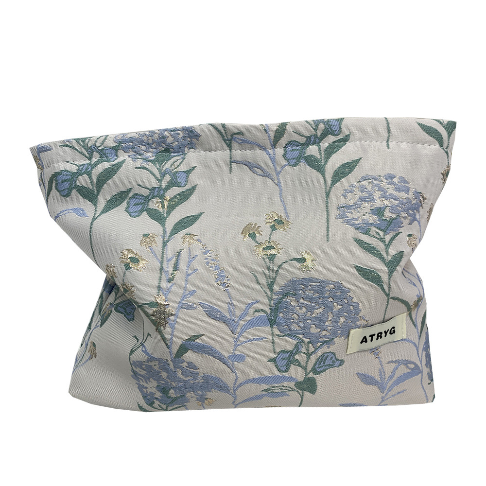 Bolsa de maquillaje, una pequeña bolsa fresca portátil de gran capacidad, bolsa de almacenamiento para productos de cuidado de la piel, bolsa de mano.