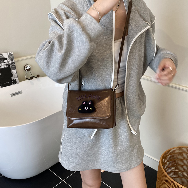 Caricatura lindo gatito niñas y niños bolsos de hombro letras extranjeras bolsos de bebé otoño y invierno nuevos bolsos de niños