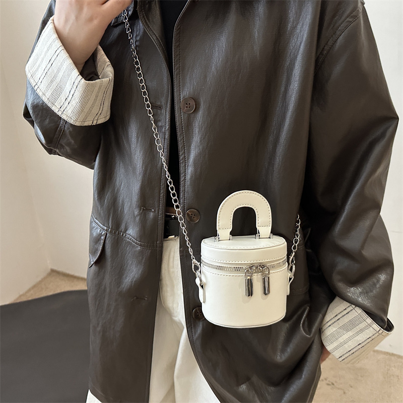 Otoño y invierno coreano bolso de cubo de color contraste para mujeres 2024 nuevo bolso de mano de moda de un hombro bolso de cilindro casual