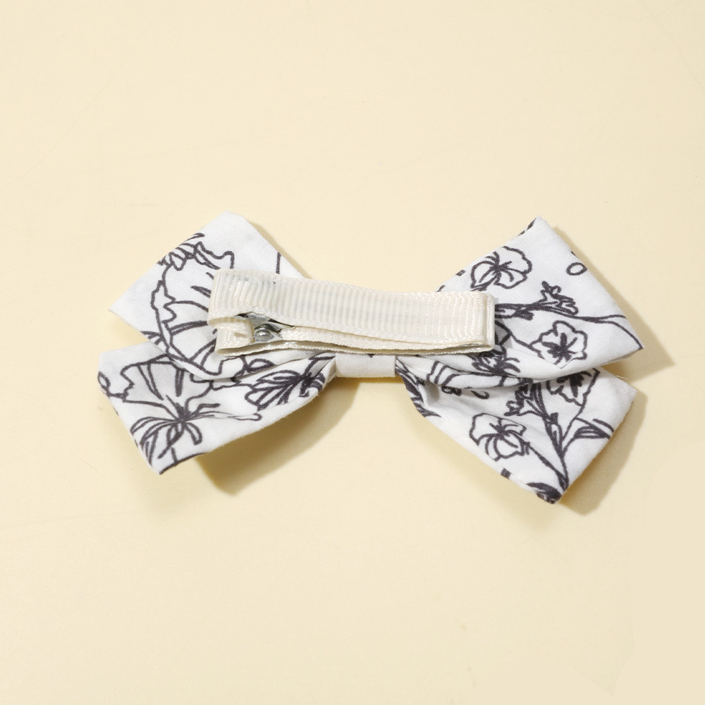 Fermagli per capelli con fiocco per bambine clip stampate_voghion.com