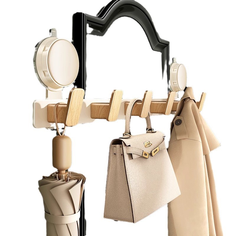 Gancho de ventosa detrás de la puerta una fila de agujeros sin perforación fuerte portante de carga en el área de percha de ropa colgada por el portal en la puerta de entrada de almacenamiento de estantes