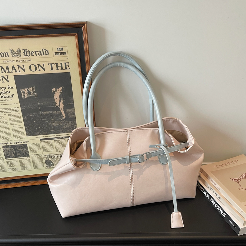 Bolsos de tendencia diaria coreana 2026 primavera nueva moda simple gran capacidad bolso de hombro bolso especial