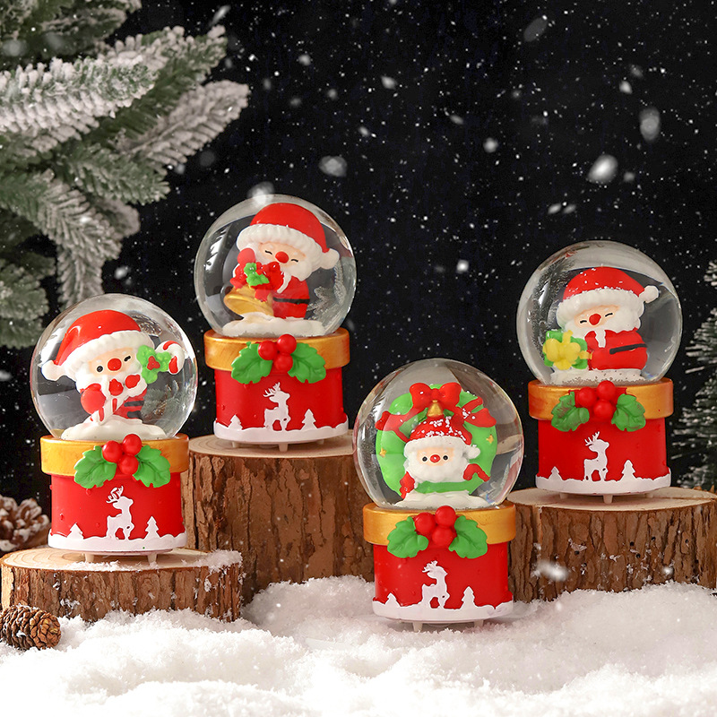 Una variedad de regalos de decoración de Navidad Navidad iluminante bola de cristal caja de música ventana diseño de velas lámparas de viento árbol de Navidad