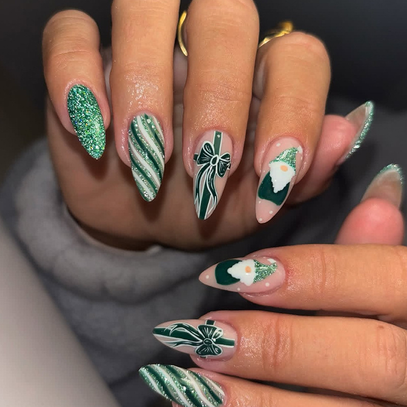 Medium almond-shaped Christmas manicure with green glitter stripes, Santa Claus and bow ribbon design, wearable nails Medium almond-shaped Christmas manicure with green glitter stripes, Santa Claus and bow ribbon design, wearable nails