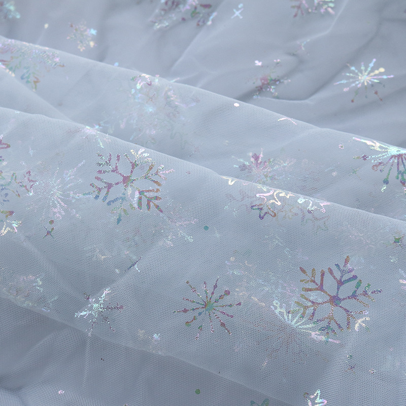 Nueva tela de malla de poliéster, tela de estampado en caliente de copo de nieve de color mágico, vestido de niña de primavera y verano, tela de falda de princesa