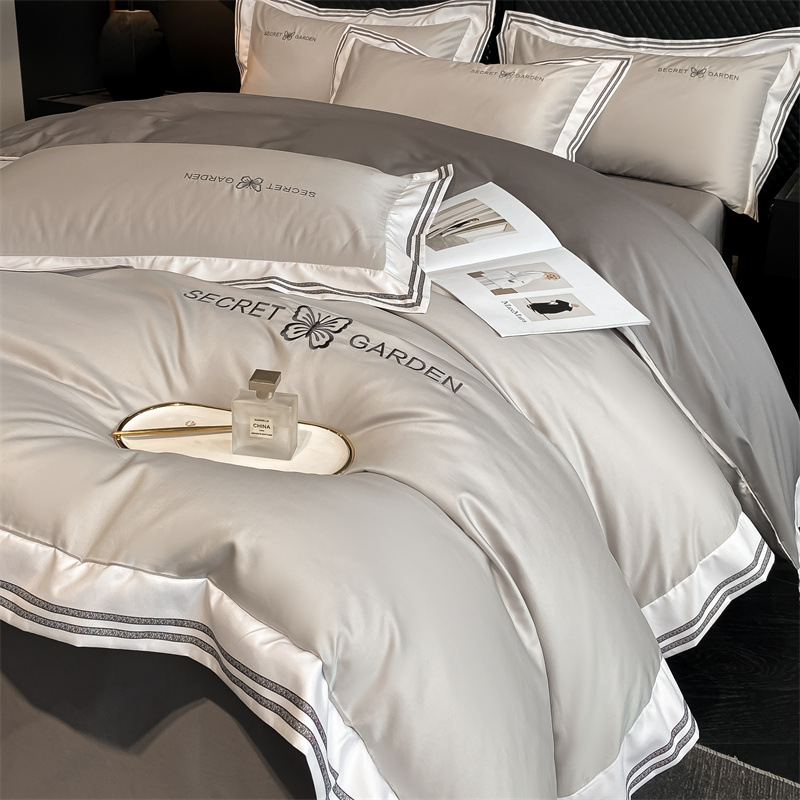 Simple ligero de lujo algodón puro cuatro piezas de sábanas de algodón ropa de cama textil doméstico cuatro estaciones tres piezas de conjunto general