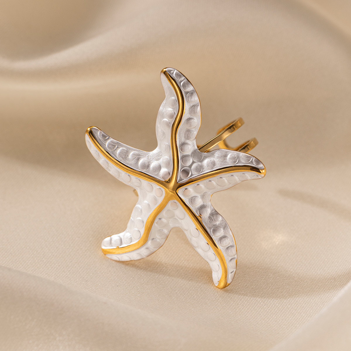 Anillo de acero inoxidable europeo y americano de Tena, sentido de nicho de alta gama, estrella de mar, playa, viento de vacaciones, anillo de acero de titanio, lujo ligero femenino
