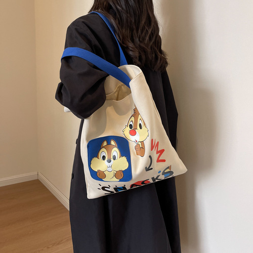 Original niche canvas bag for women, new cartoon Donald Duck hand-held tote bag for college students, reading single-shoulder cross-border