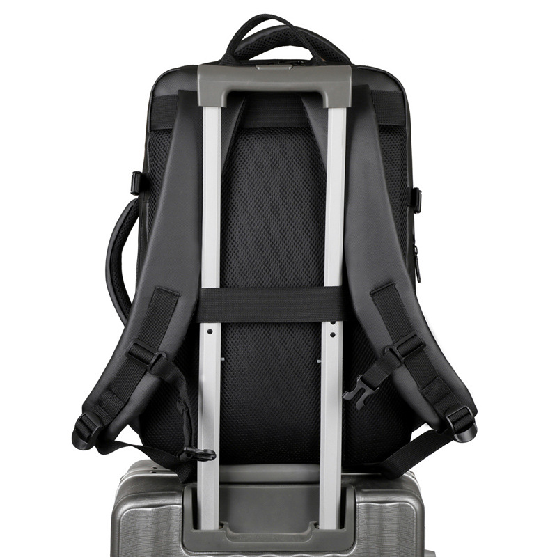 Mochila simple de color sólido de gran capacidad para hombres con capacidad de expansión multi-compartimiento USB colgando varilla de tracción mochila de viaje