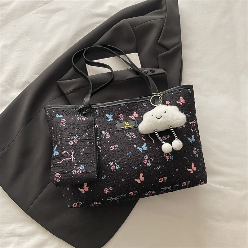 2026 flores coreanas mariposas de gran capacidad de viaje de primavera nueva moda moda extranjera bolso de hombro
