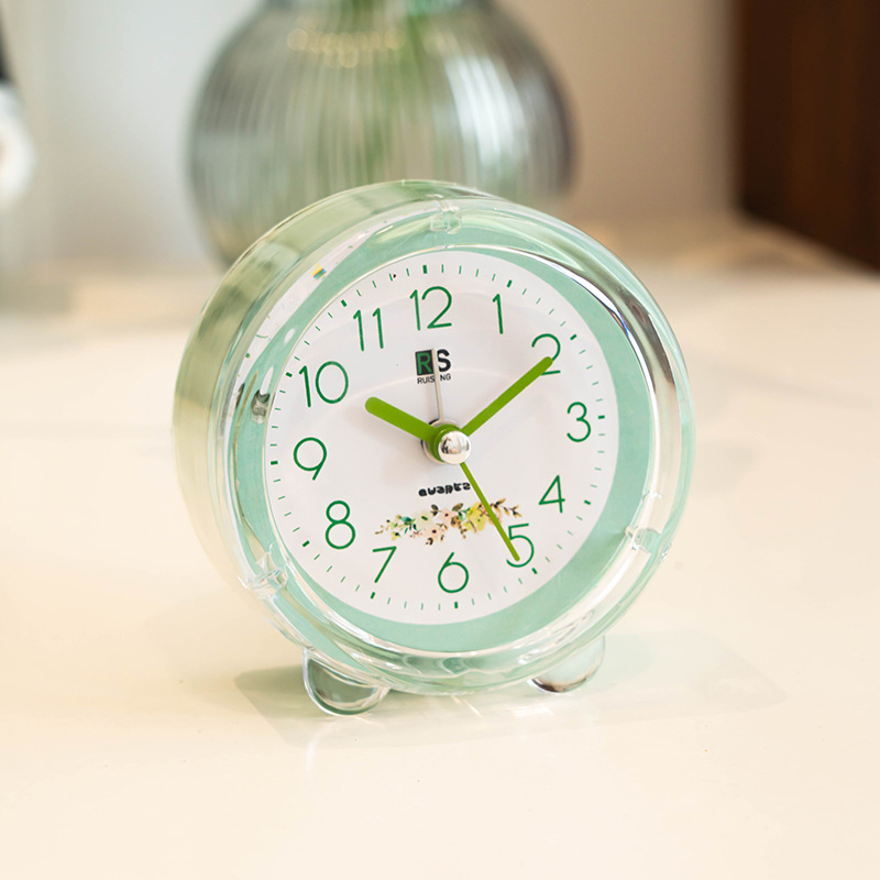 Ventas de fábrica reloj despertador de plástico redondo estudiante reloj de color caramelo con luz de dibujos animados claro reloj despertador fácil de llevar