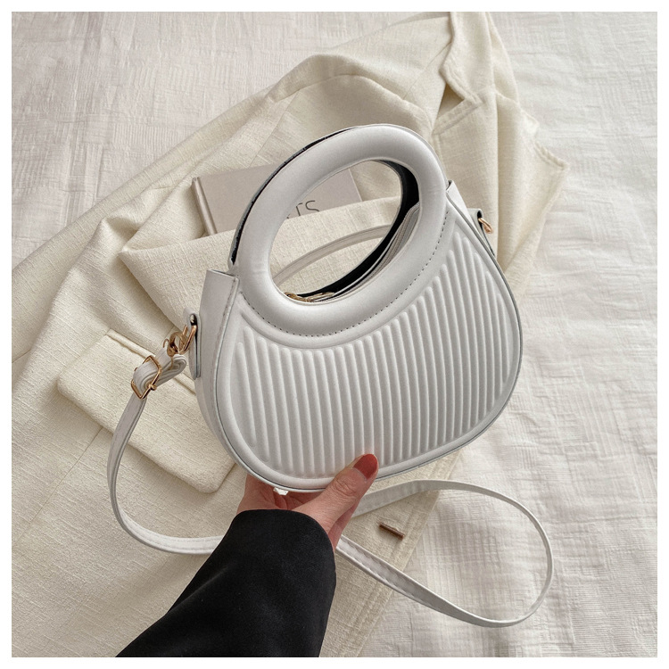 Fresco dulce dopamina color sólido rayas bolso de las mujeres este año popular pu estilo occidental bolso de hombro redondo