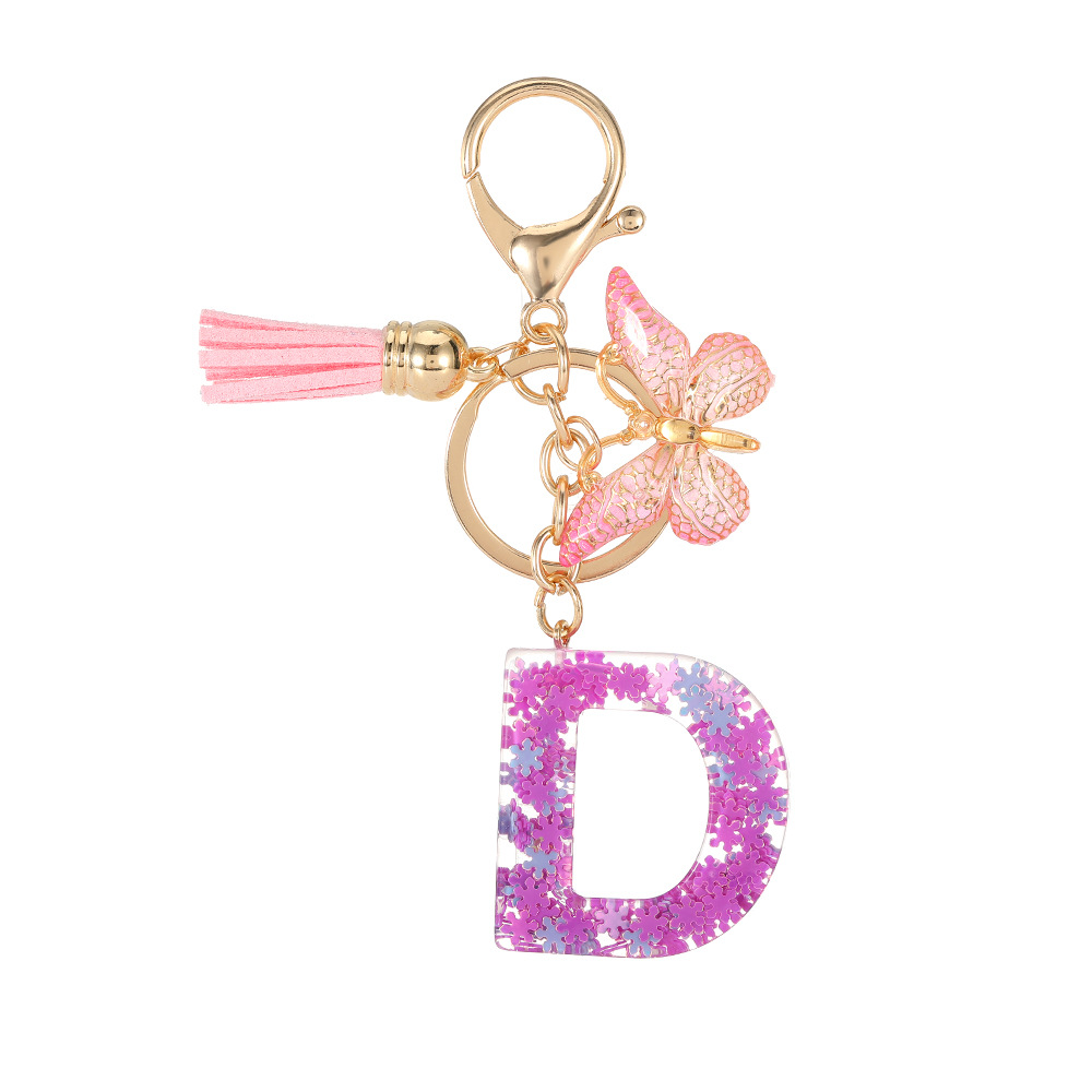 Nuevo color púrpura claro mezcla de polvo brillante letras inglesas resina llave colgante estilo simple mariposa borda colgante
