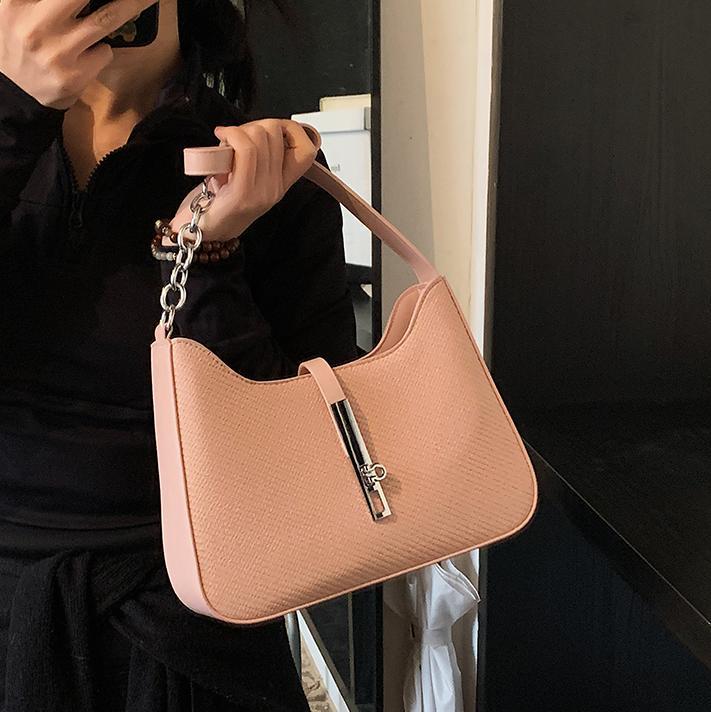 Nicho de diseño simple y versátil bolso de braza para mujeres 2025, nuevo estilo de alta calidad bolso de hombro de moda bolso de trabajo de viaje de mujer
