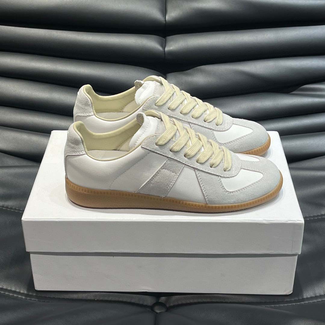 Estación europea 2025 nuevos zapatos de entrenamiento alemanes para hombres y mujeres zapatos planos casuales de todo fósforo zapatos de pareja con cordones de cuero zapatillas de deporte